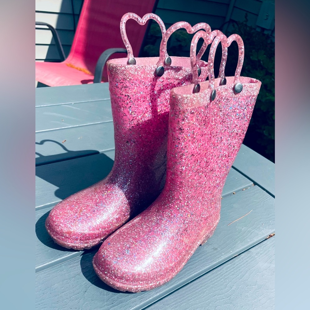 Girl’s pink and glitter rubber rain boots. Toddler size 10.